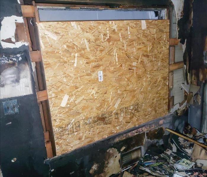 Home boarded up after fire
