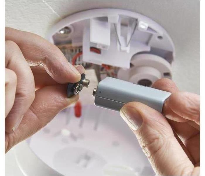 Changing batteries to a smoke alarm